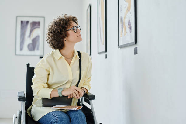 istock Girl with disability visiting art gallery 1432867398