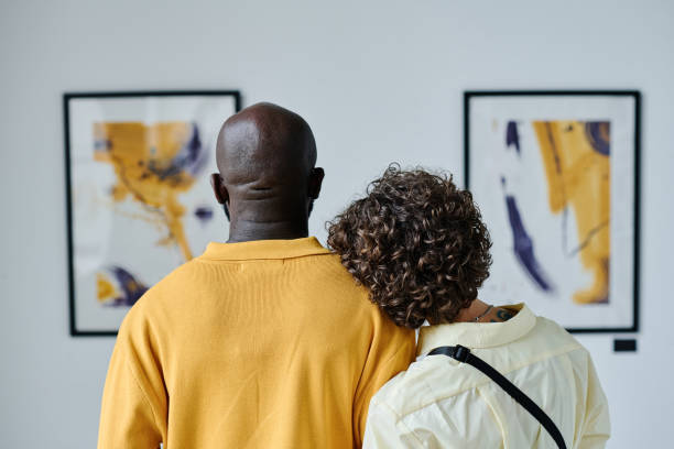 Multiethnic couple enjoying art at gallery