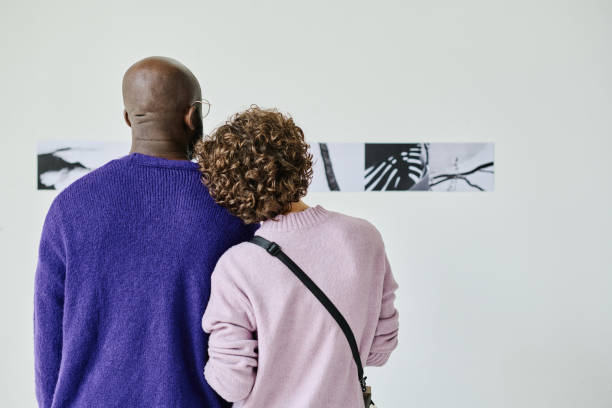 istock Young couple watching at modern art 1432867633