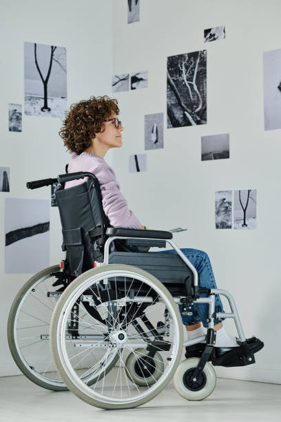 istock Woman with disability visiting exhibition 1432868138