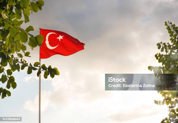 The Flag Of Turkey Is Developing In The Blue Sky Stock Photo - Download Image Now - Blue, Celebration, Color Image