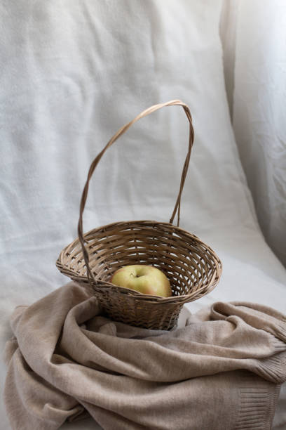 istock An apple in a wicker basket in a cozy space 1432870546