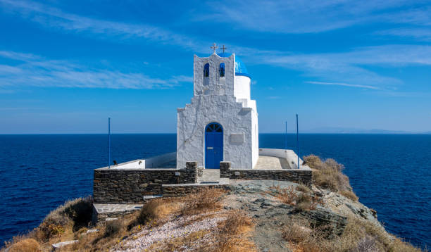 Greek Orthodox chapel on a rocky island outcrop stock photo