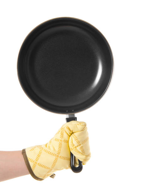 istock hand in gloves holding pan 1432870906
