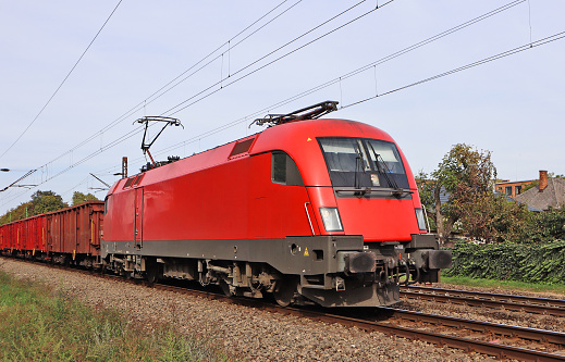 Red engine on the railway track