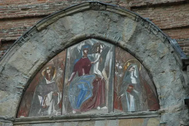 Photo of Pictorial detail above the entrance door of the church of San Domenico di San Miniato. Pisa