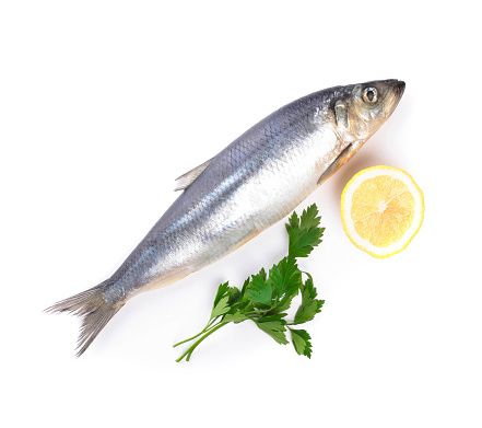 fish with lemon and parsley isolated on white background
