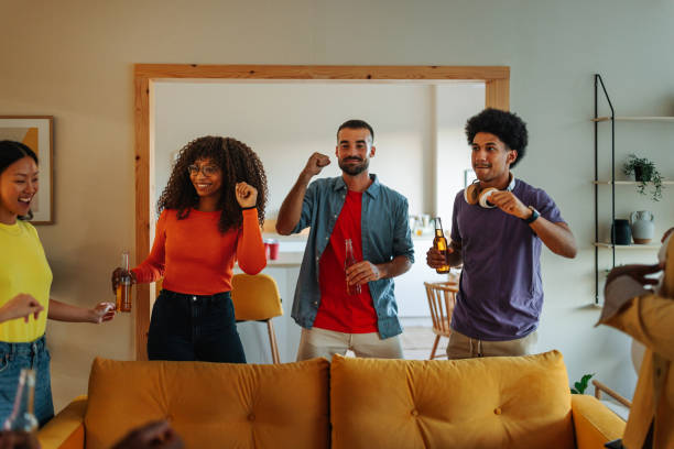 istock Friends dancing at house party. 1432879332