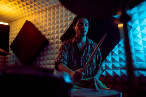 istock Caucasian male drummer, playing drums at the recording studio 1432880754