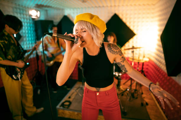 istock Young musicians having rehearsal at the music recording studio 1432881182