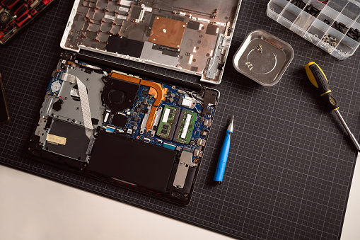 High angle view of disassembled laptop on the desk