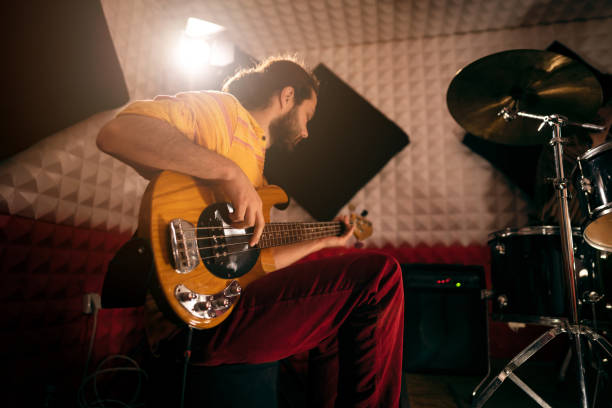 istock Guitarist player, playing electric guitar at the music studio 1432884062
