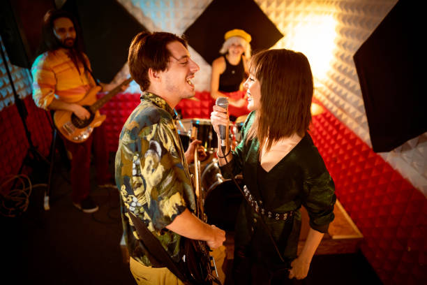 istock Band at the recording studio, recording their new song 1432886174