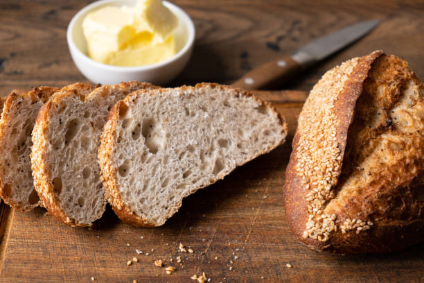 istock Artisan bread and butter on wooden board 1432886223