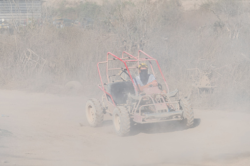Doha, Qatar- February 23, 2018: Off road buggy car in the sand dunes of the Qatari desert.