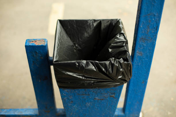 istock Urn with bag. Place for garbage. Trash can with black bag. Public garbage on street. 1432886716