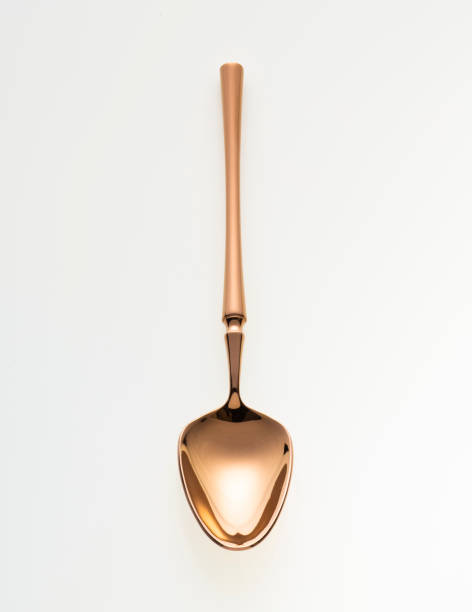 istock Golden spoon isolated on white background. Studio shot. 1432890271