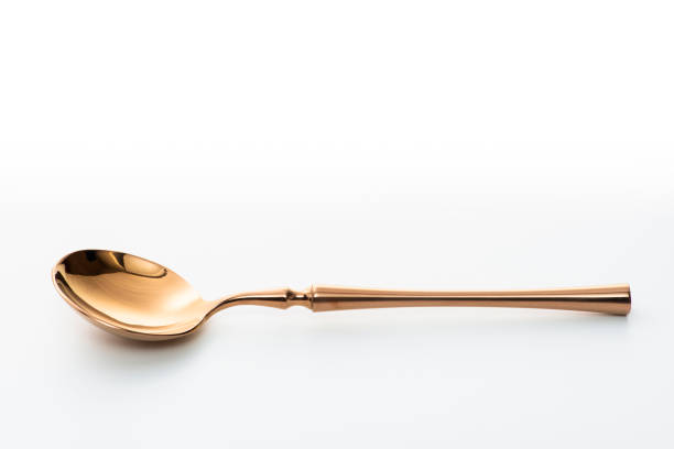 istock Golden spoon isolated on white background. Studio shot. 1432890284
