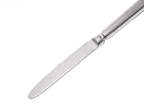 Big butcher knife on bagging fabric background. Closeup view of weapon or utensils with long blade and handle like machete, chopper for mincing meat in grocery shop or restaurant