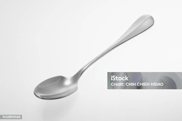 Silver Spoon Isolated On White Background Studio Shot Stock Photo - Download Image Now