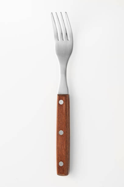 istock Wooden fork isolated on white background. Studio shot. 1432890568