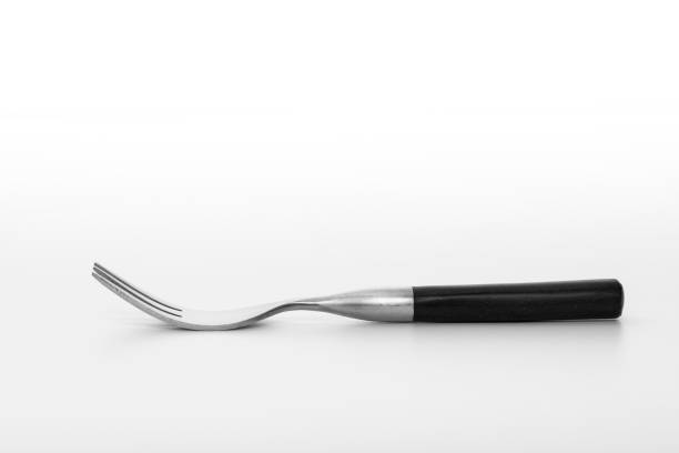 Wooden fork isolated on white background. Studio shot.