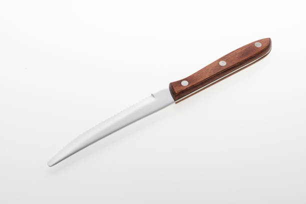 istock Wooden silver knife isolated on white background. Studio shot. 1432890600