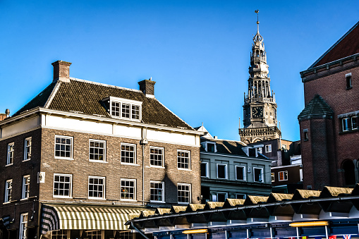 De Oude Kerk Clocktower And Builings Surrounding It In Amsterdam, The Netherlands