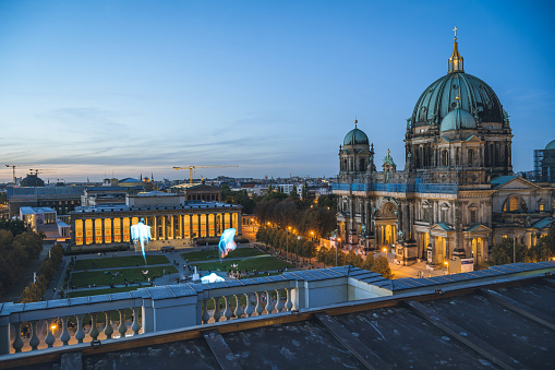 panoramic view on Berlin skyline with Berlin Cathedral and Lustgarten in the foreground at sunset hour