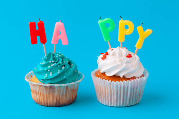 istock Happy birthday cupcakes on bright colored background 1432890955