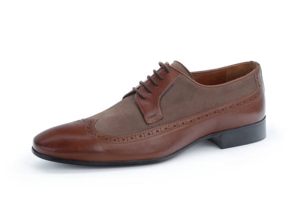istock Brown formal male leather shoes isolated on white background 1432892196