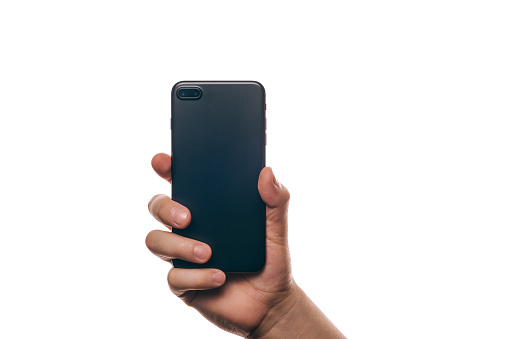 black cell phone in hands on white background