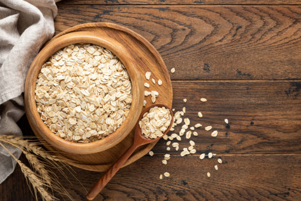istock Rolled oats or oat flakes in wooden bowl 1432894706