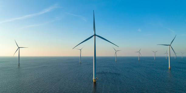 istock Wind turbines in an offshore wind park producing electricity 1432896739
