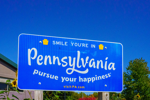 Matamoras, PA, USA  October 11, 2022: A Smile Your In Pennsylvania Pursue Your Happiness sign at the Welcome Center in Matamoras.