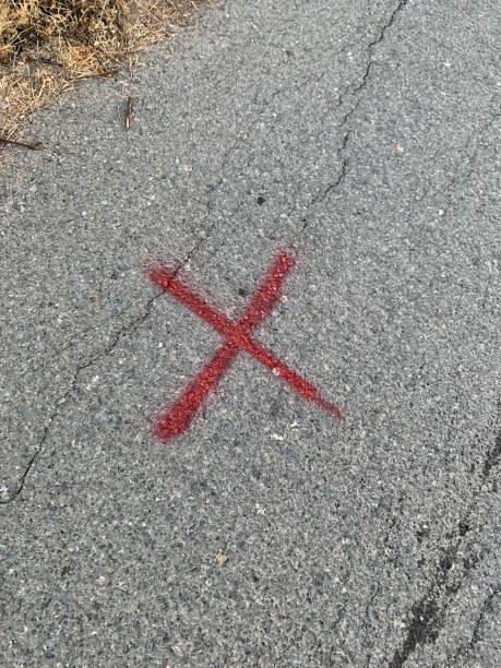 istock Red cross sign on the asphalt 1432898594