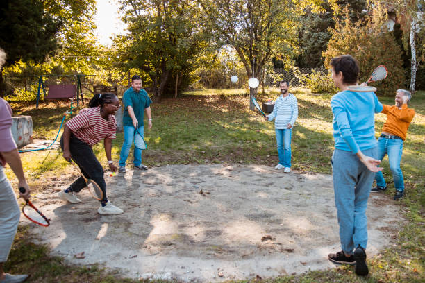 istock Playing badminton and having fun on a sunny day 1432899204