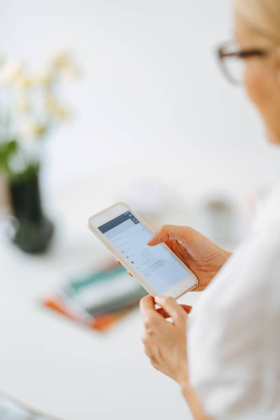 istock Close Up Photo Of Woman Hand Using A Mobile Phone At Work 1432899238