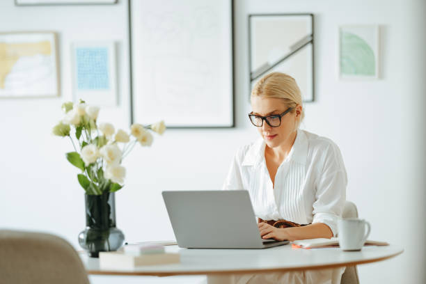 istock Beautiful Business Woman Using A Laptop Computer At Work 1432899284