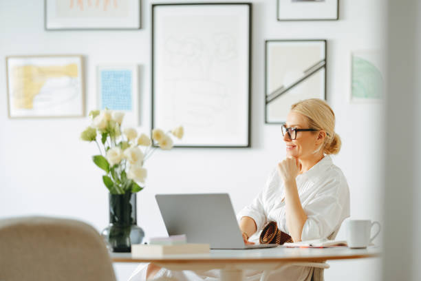 istock Beautiful Business Woman Using A Laptop Computer At Work 1432899287