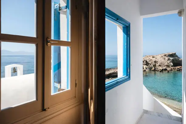 View through the open window. Mediterranean Sea with Greek island in front of Lefkos, Karpathos.