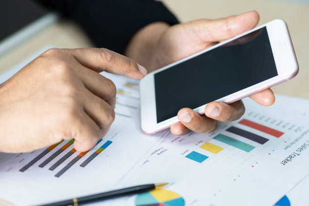 istock Asian accountant working and analyzing financial reports project accounting with chart graph and calculator in modern office, finance and business concept. 1432901610