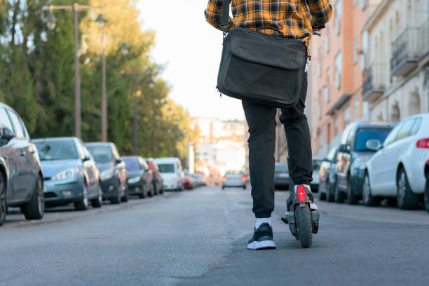 Unrecognizable man on an electric scooter