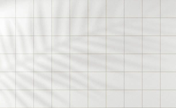 istock White glossy tiles bathroom or kitchen background with podium 1432903451