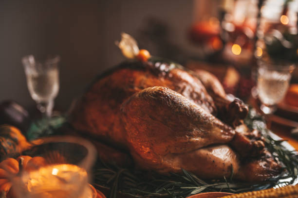 istock Thanksgiving holiday dinner table setting with fall decoration and pumpkins 1432909823