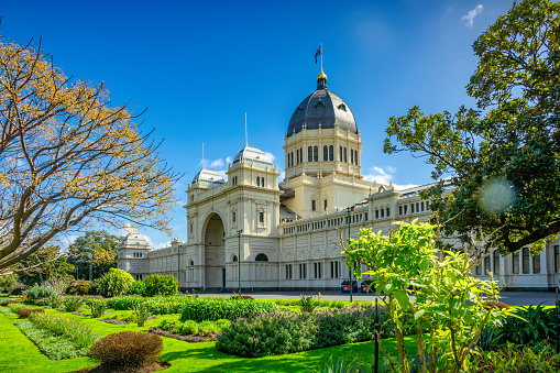 The Royal Exhibition Building and Carlton Gardens in Melbourne, Victoria, Australia on a sunny day. The Royal Exhibition Building was completed in 1880, it is a UNESCO World Heritage Site.