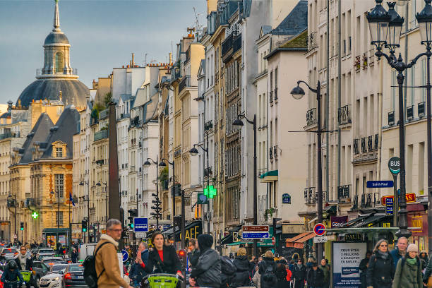 Crowded urban day street scene at historic center of paris, france