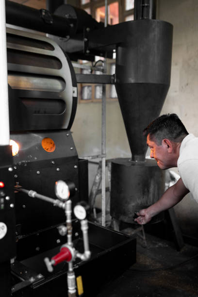 istock An Hispanic man is checking the burner of a coffee roaster machine 1432913785