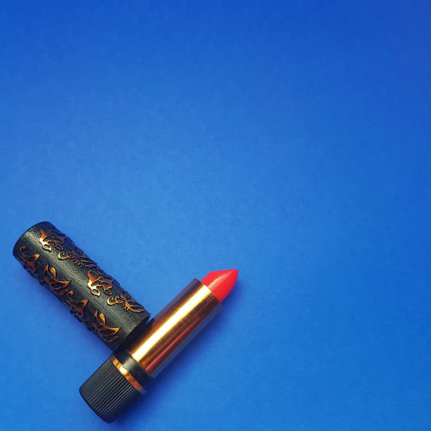 istock An old simple lipstick on a blue background 1432914001