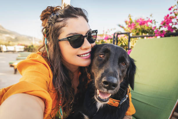 istock Young Woman Takes Selfie With Her Dog 1432914087